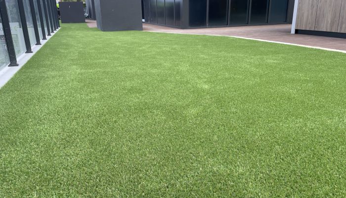 High rise artificial turf installation Balcony synthetic turf BBQ area All About Turf